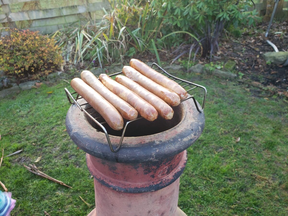 sausages on chiminea